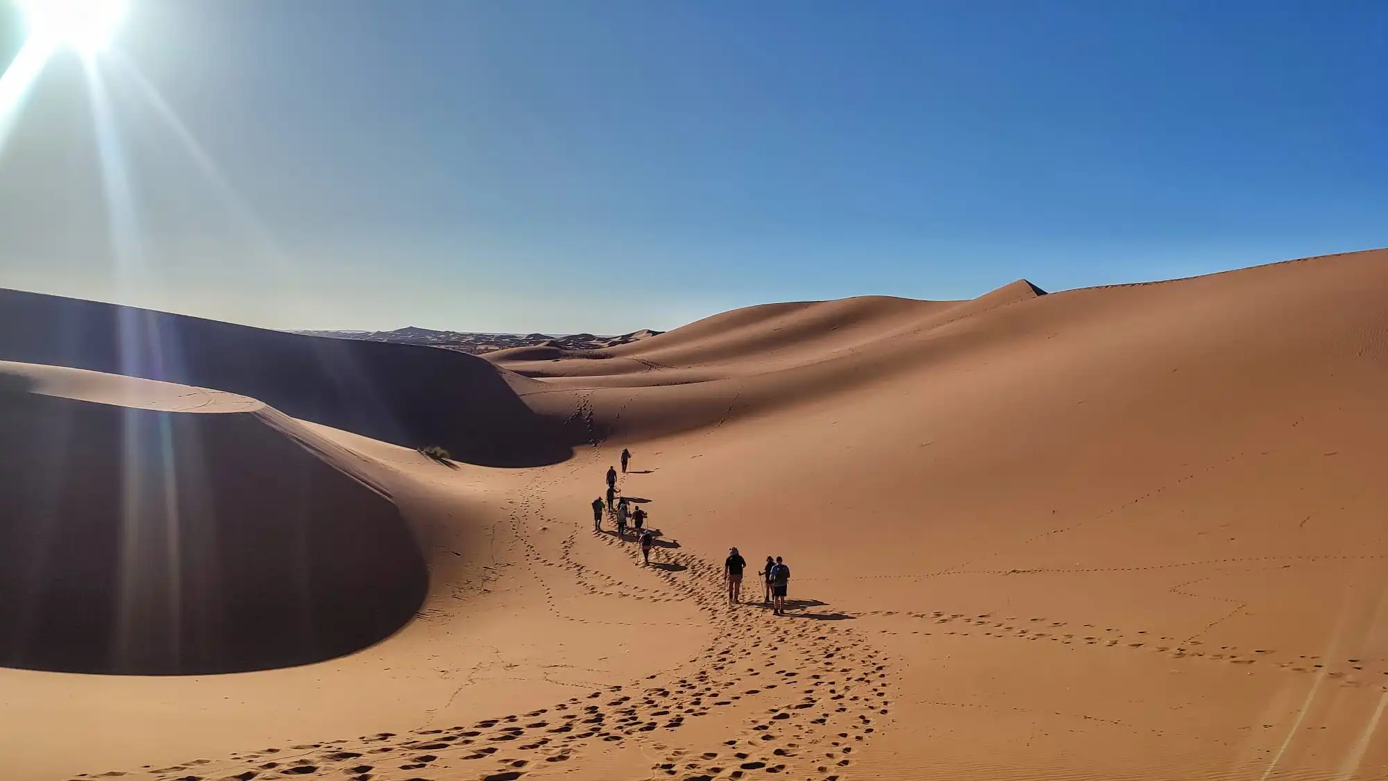 hiking across saharan dunes